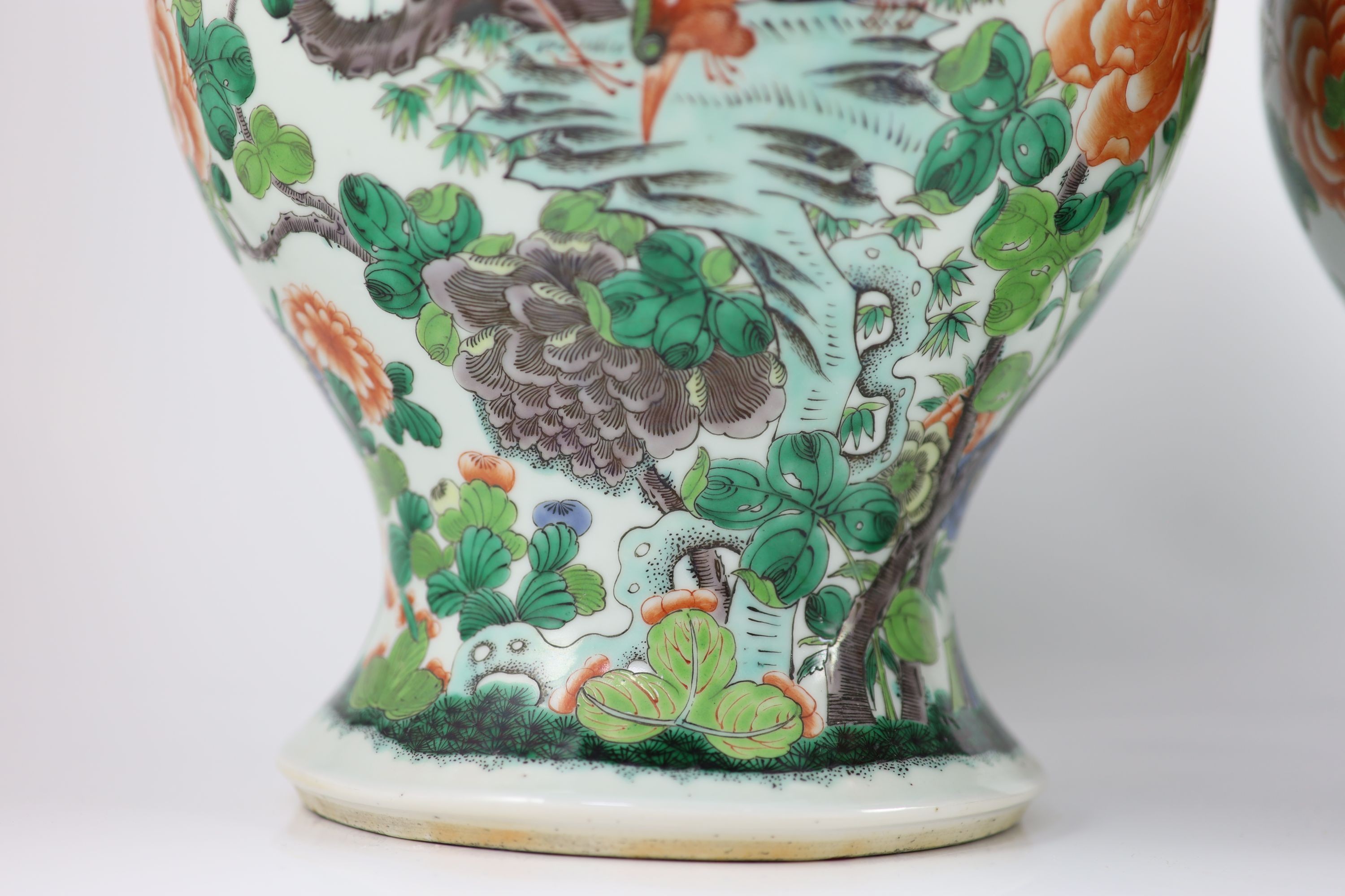 A pair of large Chinese famille verte jars and covers, late 19th century, 45cm high, restoration